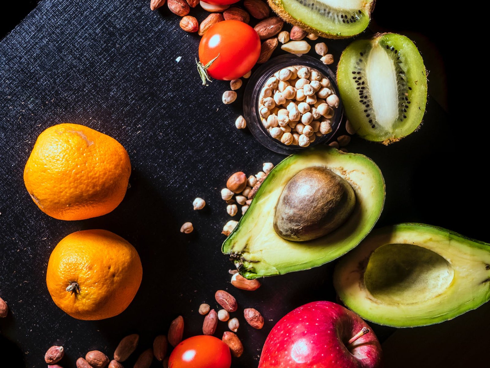 assorted fruits on black textile